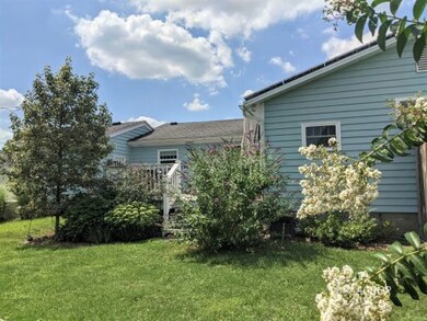 Back of house with deck