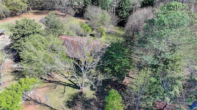 Aerial view featuring a view of trees