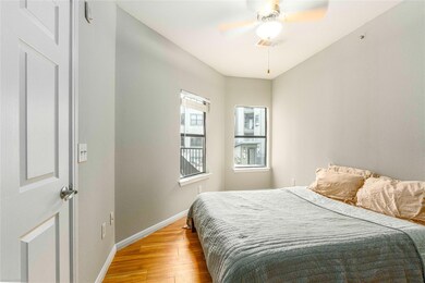 Bedroom with light wood-type flooring and a ceili