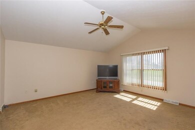Living room on main level with plenty of natural l