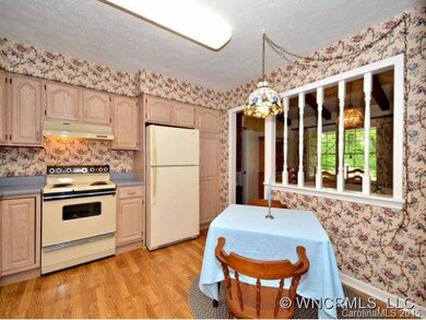 Eat in.  wood laminate floor