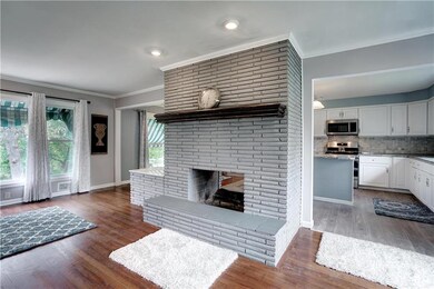See thru fireplace to kitchen