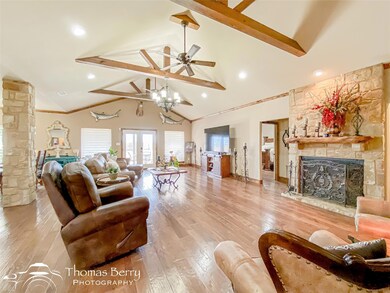 Living area with beamed ceiling, high vaulted ceil
