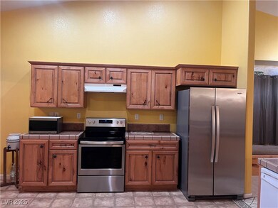 Kitchen with appliances with stainless steel finis