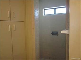 and large tiled shower. One huge closet and linen 
