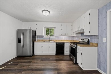 Kitchen featuring appliances with stainless steel 