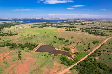 Aerial view featuring a rural view and a water vie