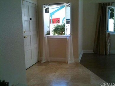 ENTRYWAY.  One of the windows is open forinside br