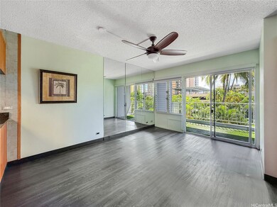 Spacious living room and open kitchen with island.