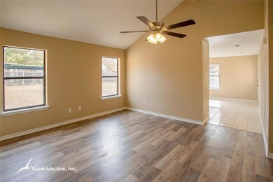 Open living area with new laminate wood flooring