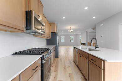 The kitchen offers loads of cabinet and prep space.
