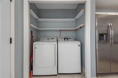Laundry area with washing machine and clothes drye