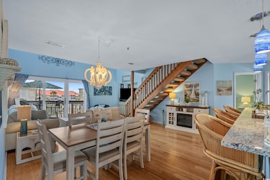 Dining area featuring a notable chandelier, a glas