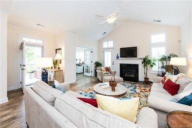 Spacious living room with vaulted ceiling, and gas