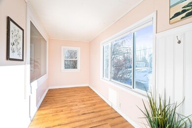 Interior space with crown molding and light hardwo