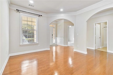 Empty room featuring light wood-style flooring, vi