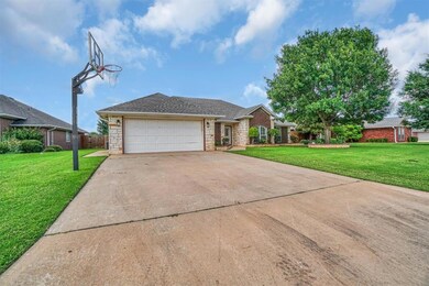 View of front of home with stone siding, concrete driveway, and an attached garage