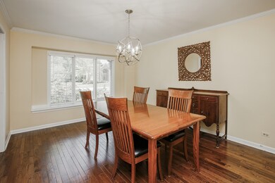 Lovely dining room with bay window and hardwood fl