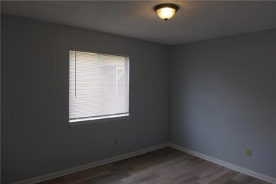 Unfurnished room featuring dark wood-type floorin