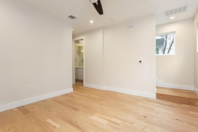 Empty room featuring light wood-style flooring, a