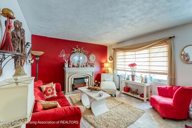 bright sunken living room with fireplace