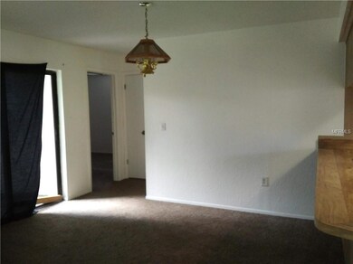 Living room/dining room combo with sliders to back