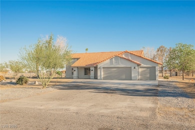 View of front of house featuring a tiled roof, an