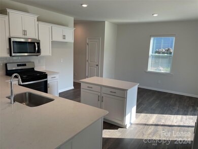Chef's kitchen with island and dining area