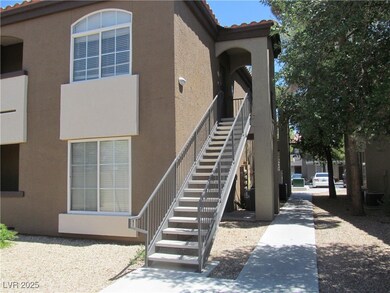 View of home's exterior with stucco siding, a tile