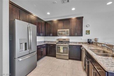 Kitchen featuring gas stove, microwave and dishwas