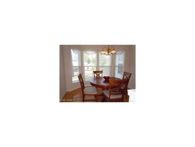 Bright and cheerful eat in kitchen with bay window