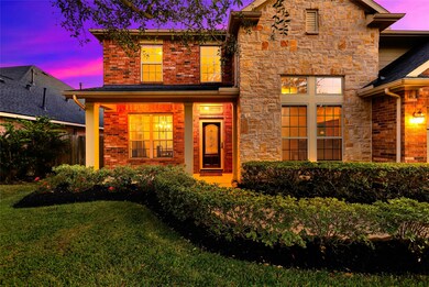 What a great entrance! Manicured lawn and bushes will greet your guests!
