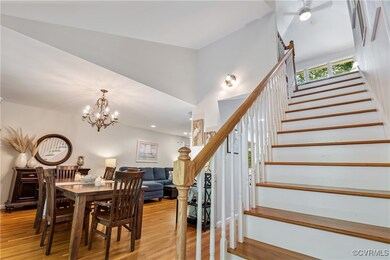Dining space featuring a chandelier and wood-type