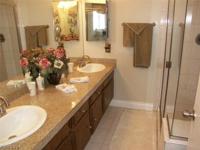 Renovated M/bath with granite tile counters and la