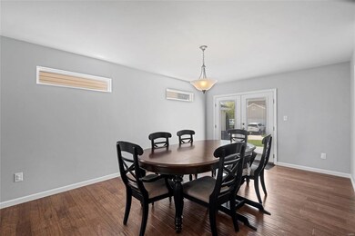 The atrium door with built-in shades leads to the 