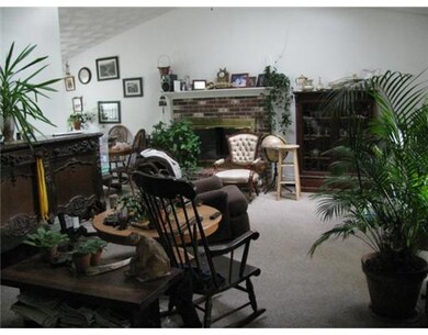 Living Room. Unit #2 Livingroom has brick fireplac