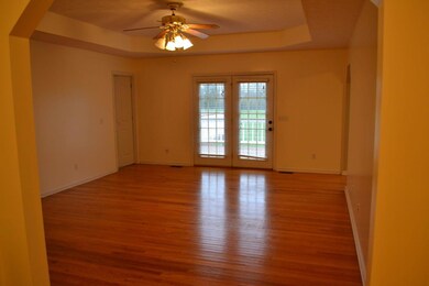 Walking in from the front door.  Beautiful hardwood floors, trey ceiling and french doors leading to the large deck.  