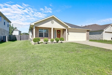 Single story home featuring driveway, a garage, a