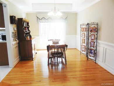 Dining Room with hardwood floor, chair rail and pi