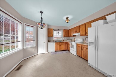 Kitchen with plenty of natural light, white applia