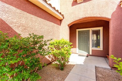 Doorway to property featuring stucco siding