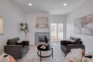 Living room featuring wood finished floors, a fir