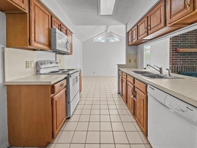 Kitchen opens to dining room