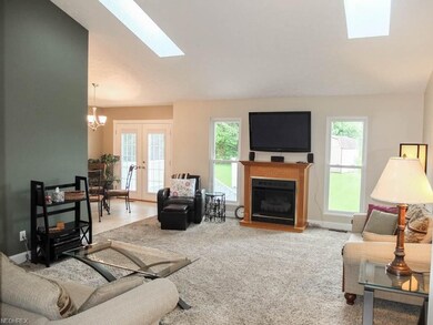 Great room offers vaulted ceilings, skylights and 