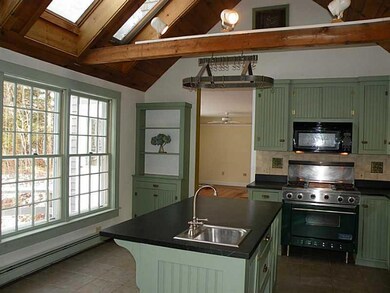 Kitchen. The ceiling is vaulted in...