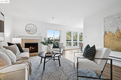 Living area with a fireplace and wood finished floors