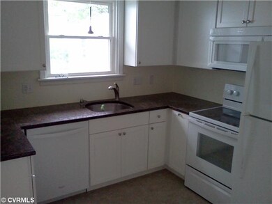 Kitchen - Renovated kitchen with all new cabinets, vinyl floor, Whirlpool appliances and granite counter.