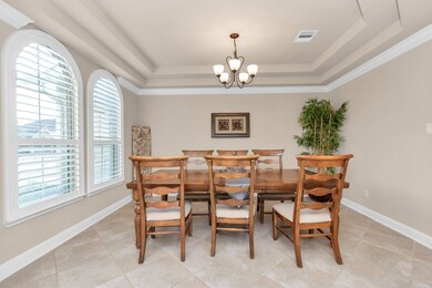 formal dining with view of front house windows