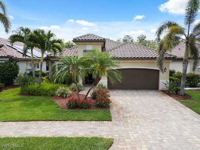 Mediterranean / spanish-style house featuring an attached garage, decorative driveway, stucco siding, and a tiled roof