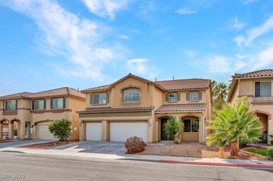 Mediterranean / spanish house with stucco siding, driveway, a garage, and a tiled roof